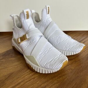 Puma White Knit Slip-On Sneakers with Gold Hardware and Gum Accents